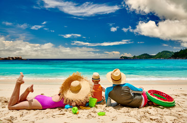 Family with three year old boy on beach