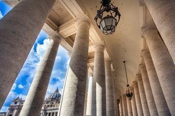 View through the colonnades at St. Peter's Square to St. Peter's Basilica in Rome Lazio Italy