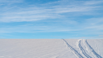 Landscape of snow covered countryside with beautiful sky