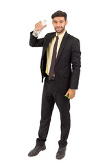 Obraz premium A handsome young businessman standing on a white background holding a plastic water bottle isolated
