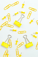 Paper clips yellow color on white background. Vertical format.