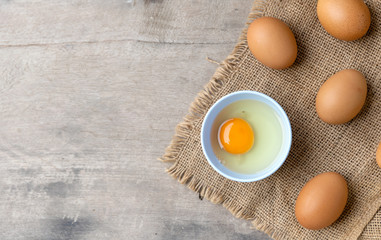 closeup egg on wooden with soft-focus and over light in the background. top view