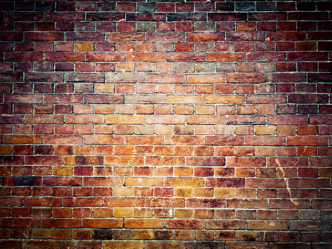 Brick wall background. Brown and red bricks, masonry texture of a building exterior