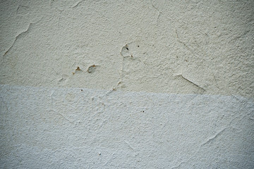 Texture of an old wall covered with paint. Background image of a worn paint coated surface