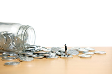 A businessmen walking on coin stack - Financial saving concept