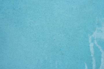 Blue torn water in pool. Water surface background at Mexico