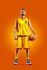 bright professional basketball player on an orange background