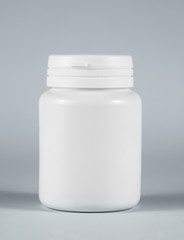 .white plastic can on a gray background
