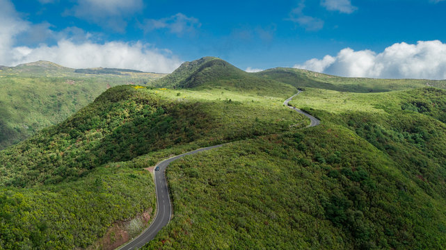 Aerial drone view of curvy road in "Paul da Serra", Madeira island, Portugal, in a sunny day