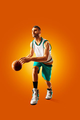 bright professional basketball player on an orange background