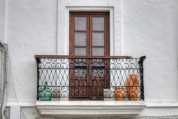 Traditional balcony of house in Vejer de la Frontera, Cadiz province, Andalusia, southern Spain