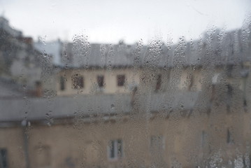 Raindrops On Misty Glass Of Window