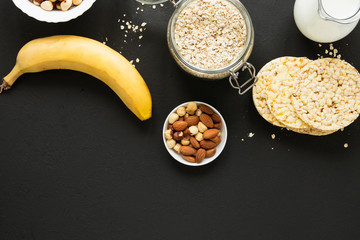 Flat lay oats jar with nuts mix and banana