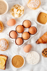 Top view eggs and dough ingredients