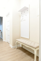 Bright little hallway. A minimum of things, a bright interior.