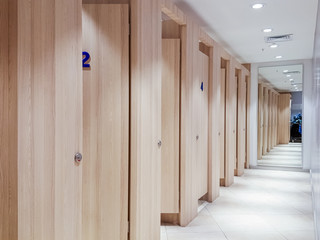 Empty changing rooms with wooden doors in a boutique