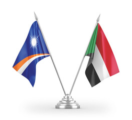 Sudan and Marshall Islands table flags isolated on white 3D rendering