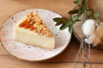 piece of  peanut cake with cream on a plate