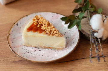piece of  peanut cake with cream on a plate