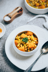 A close up shot of a chickpeas and pumpkin stew 