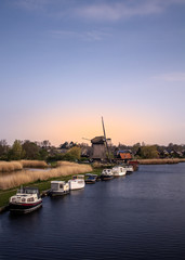 Fototapeta na wymiar Windmill in evening sun