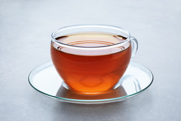 Cup of tea on a gray background.