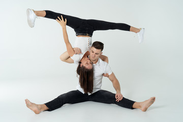 Duo Of Acrobats Showing Tricks, Isolated On White