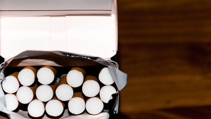 A close-up shot of a pack of cigarettes with filters
