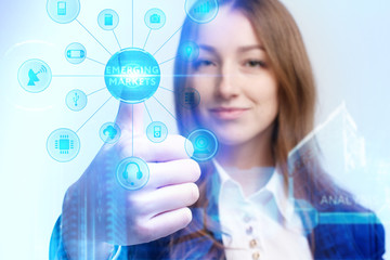 Business, Technology, Internet and network concept. Young businessman working on a virtual screen of the future and sees the inscription: Emerging markets