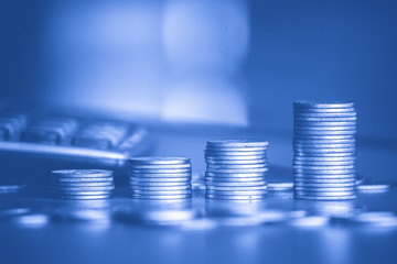 Stack of money coin wiht blue filter, Business and Financial background 