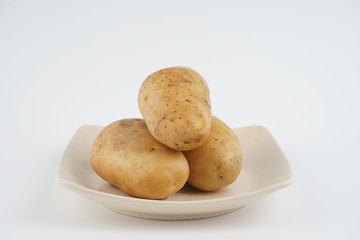 Potatoes over white background. Food concept