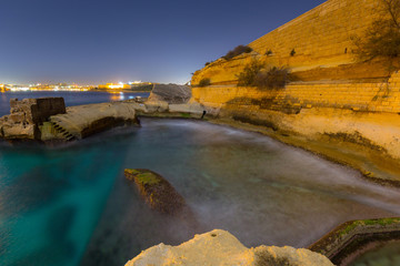 Fototapeta na wymiar Rocky coastline of Malta landscape at night