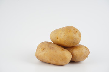Potatoes over white background. Food concept