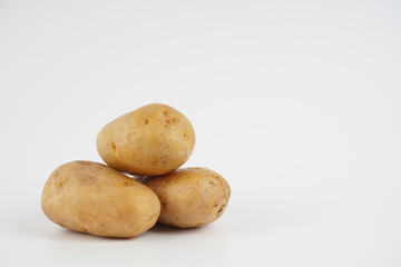 Potatoes over white background. Food concept