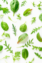 Colourful salad flat design on white background. Romaine, arugula, spinach and mizuna leaves pattern. Vegan meal ingredients