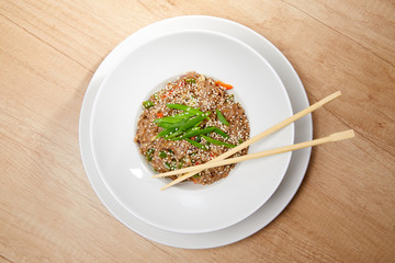 noodle with vegetables on the wooden background