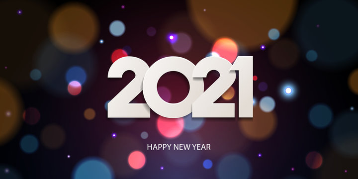 Happy New Year 2021. Holiday greeting card design. White paper numbers on a defocused colorful, bokeh background.
