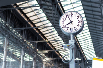 White Public Clock and CCTV Camera