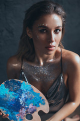Naklejka premium Woman artist with creative fantasy make up.