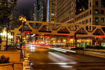 Fototapeta na wymiar Chicago, night traffic between bridges and skyscrapers