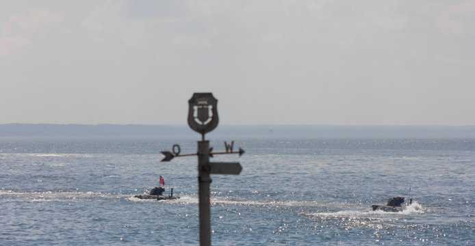 Armored personnel carriers BTR-82A floating in the water