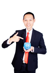 Asia business man smile and hand ponting and holding blue piggy bank on white backgrounds