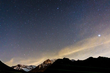 the stars and the night sky seen from the italian alps, during a fantastic winter night, near the town of Branzi, Italy - February 2020.