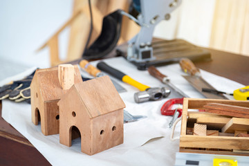 Birdhouse in carpentry workshop. DIY woodwork, woodworking and carpentry concept