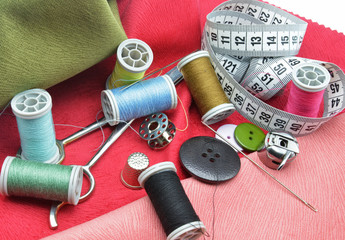 sewing accessories on fabric background