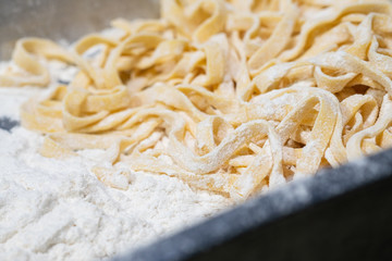 fresh pasta on kitchen table.