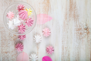 Fototapeta na wymiar Tasty white and pink meringues