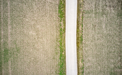 Aerial photograph of a path between fields, abstract effect by straight lines when taken vertically downwards