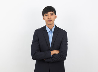 Obraz na płótnie Canvas Young handsome asian business man looking to camera with arms crossed isolated on white background.