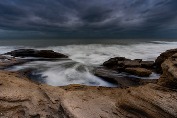 rocks in the sea at sunset